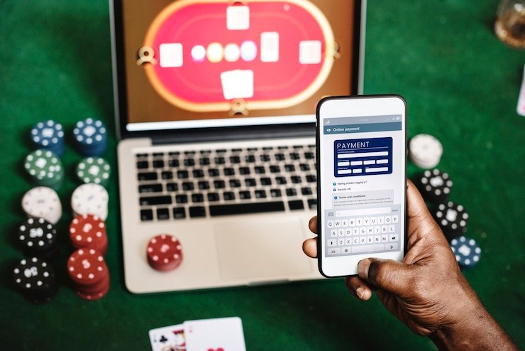 Three Card Poker betting layout and payout table displayed on screen